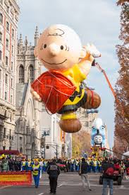 The Charlie Brown balloon soars above the New York streets at the Macys Day parade.