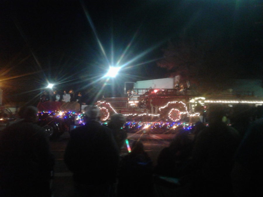 Citizens gather together to celebrate the holiday season with a parade.