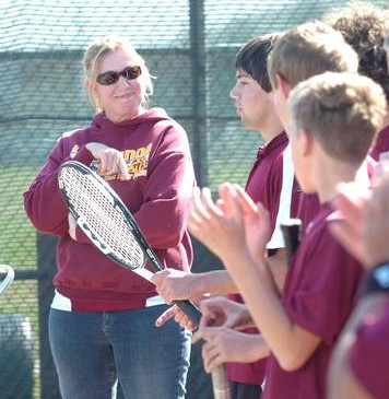 Ms. Barcellos with her tennis team.