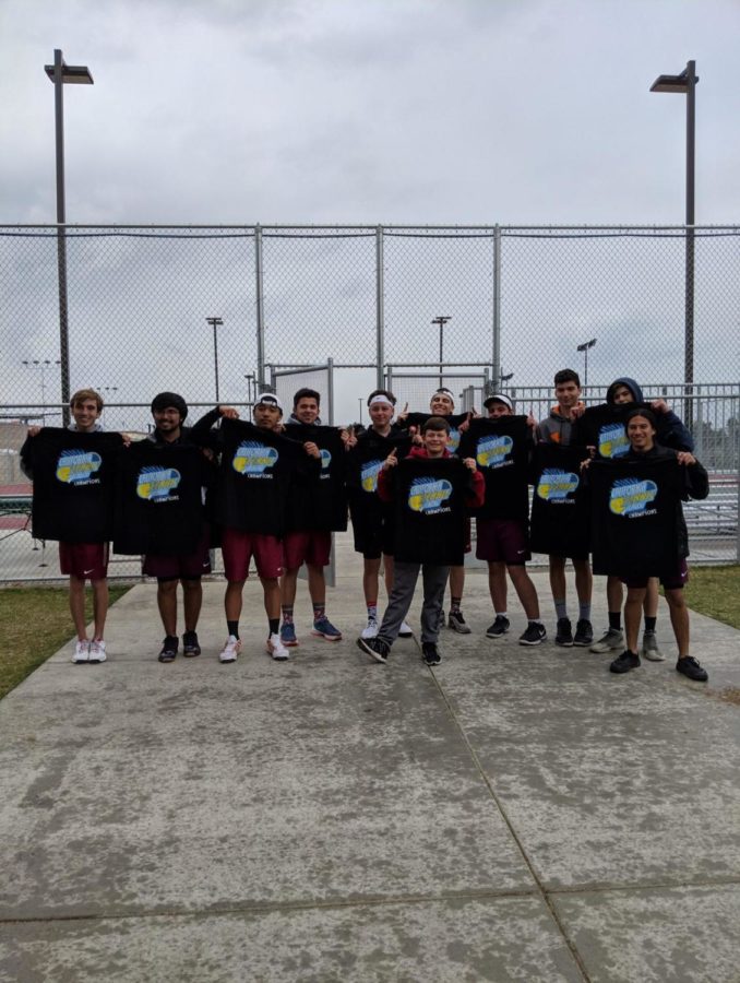 LB boys tennis team show off their champion shirts.