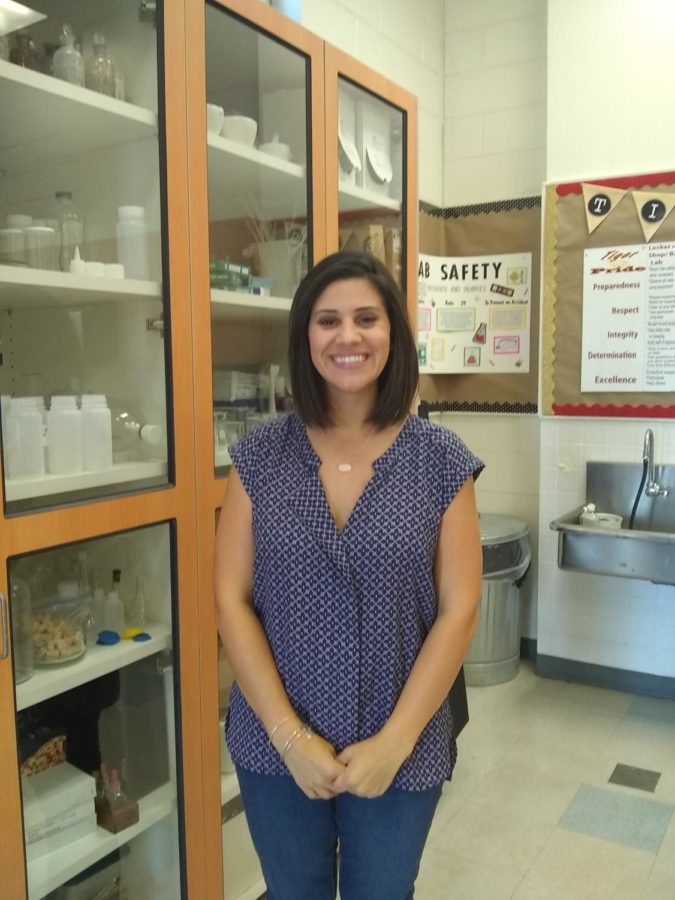 Mrs. Lopez, a new teacher, is excited about chemistry.