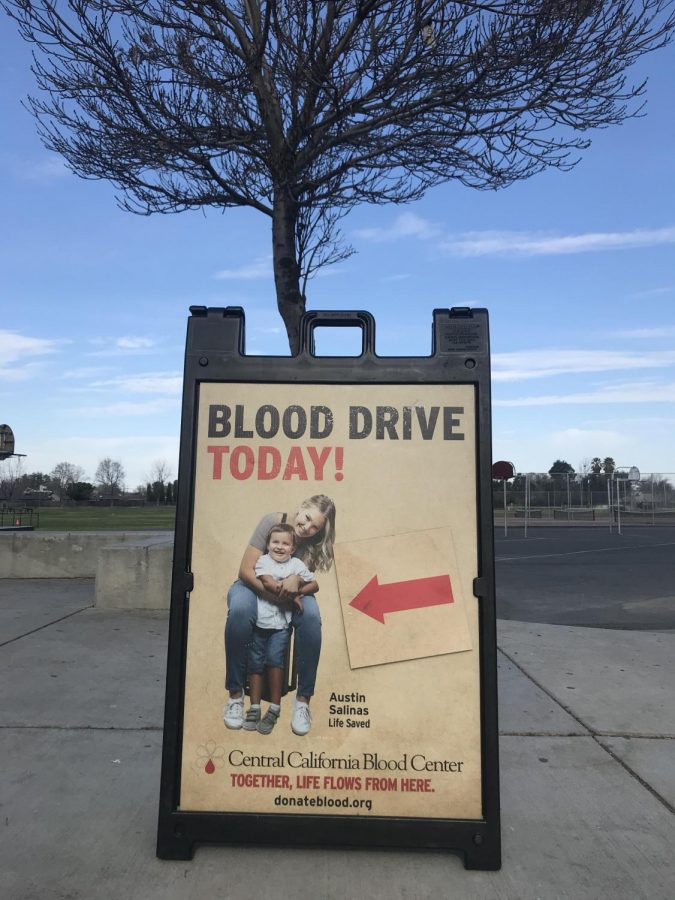 Blood Drive poster outside of entrance so students may see.