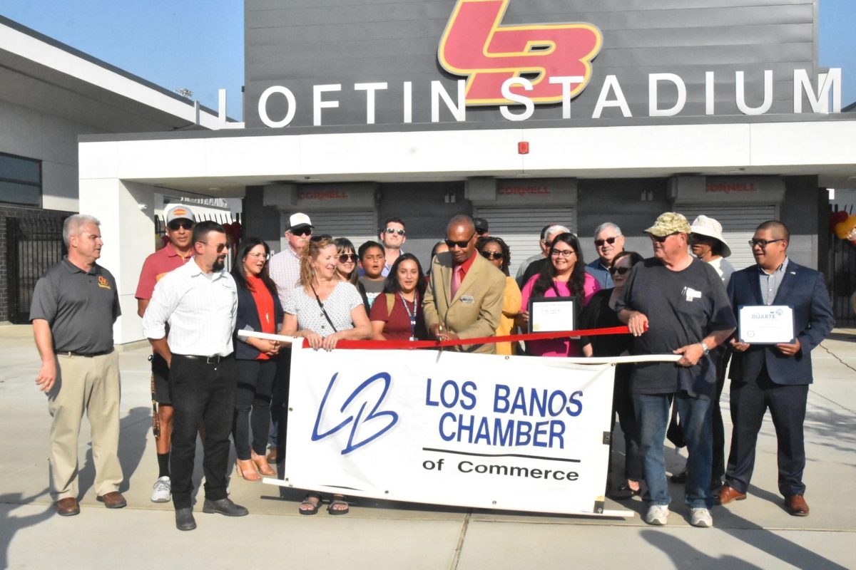 A ribbon cutting celebrates the opening of the new entrance, concession stands, and locker rooms of the Loftin Stadium.