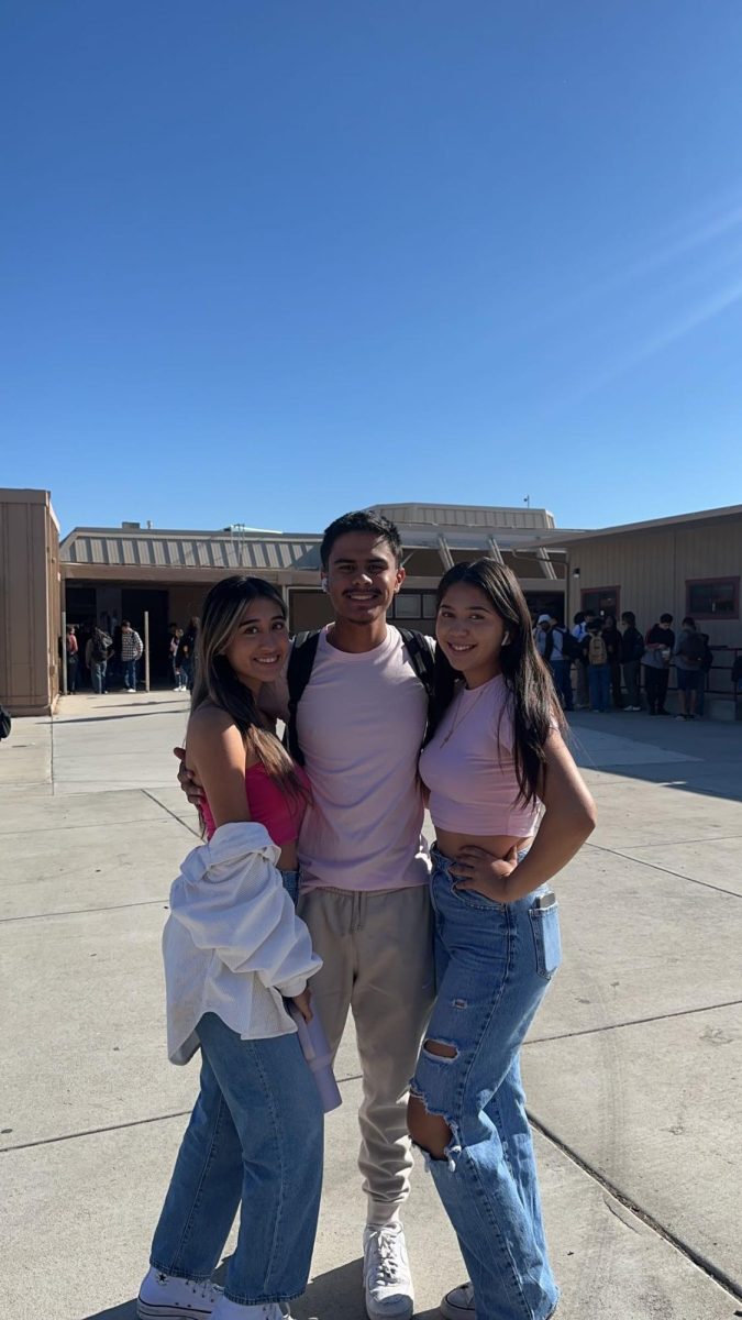 Class of 24 members, Vanessa Leal, Isaiah Castro, and Fernanda Perez show their support by wearing pink.