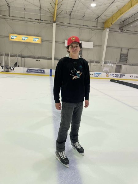 Aleksey ice skates while rocking his favorite hockey teams apparel. 