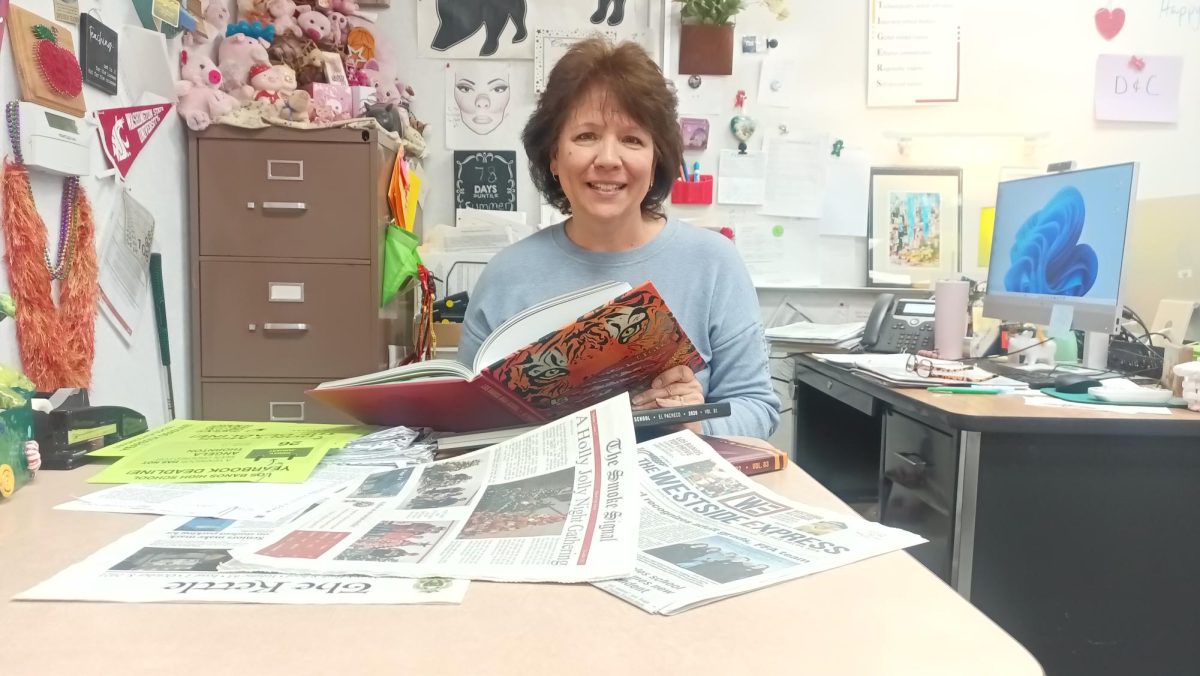 Mrs. McCullough works at making yearbooks and the school newspaper memorable for students.