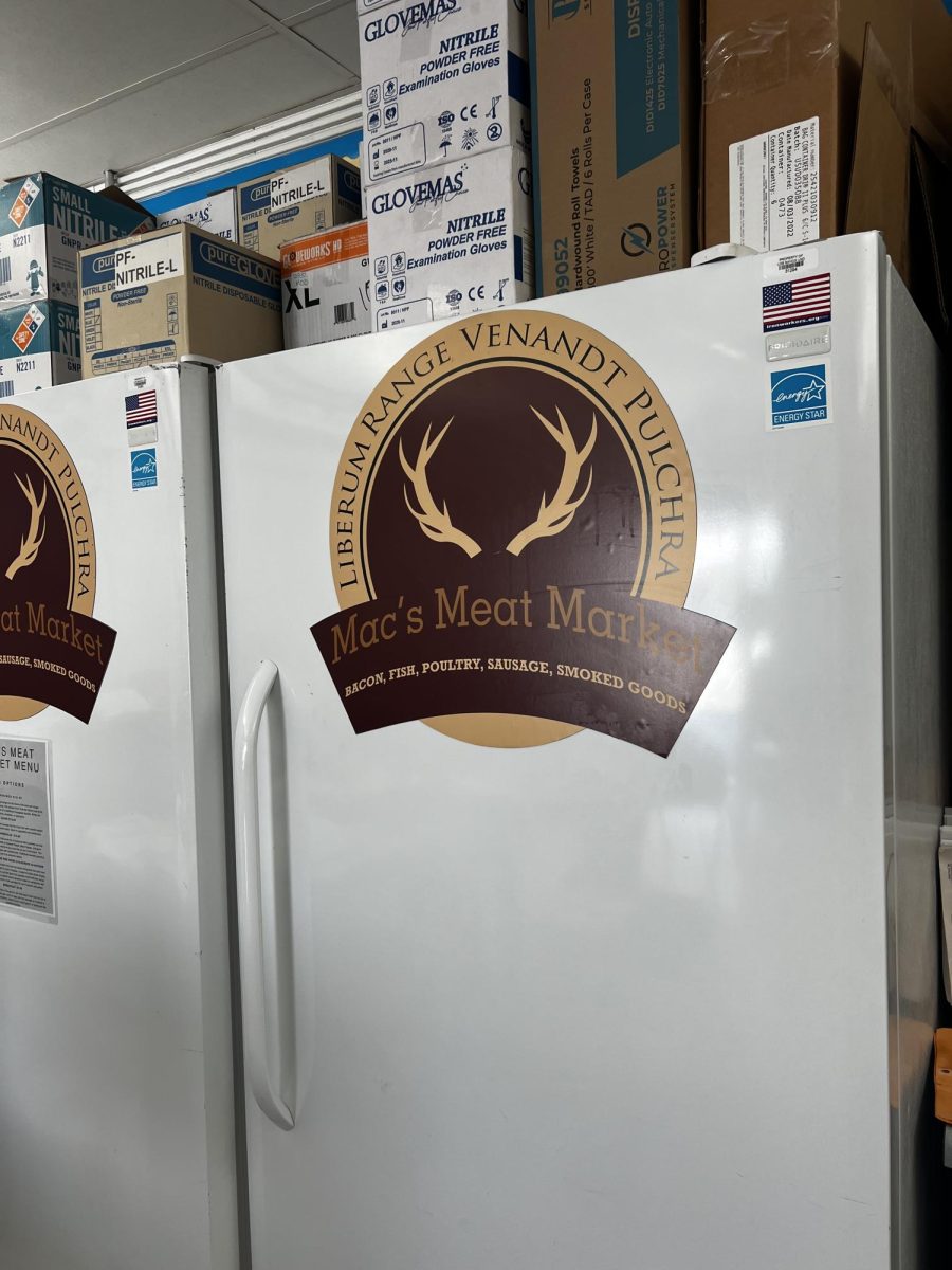 Mac's Meat Market logo was developed to  create the shirts and stickers.