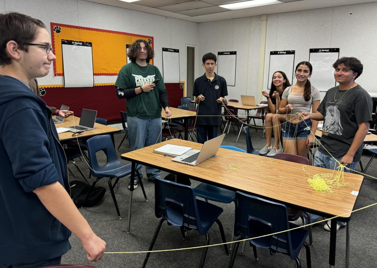 AP Computer Science students work on a group activity together.