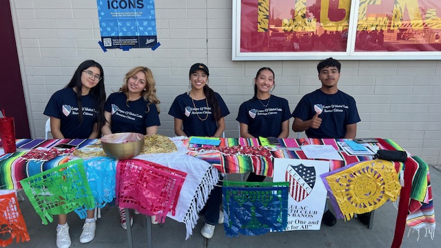 President Tiffany Tovar (middle) and her officers at their table for Back to School night!