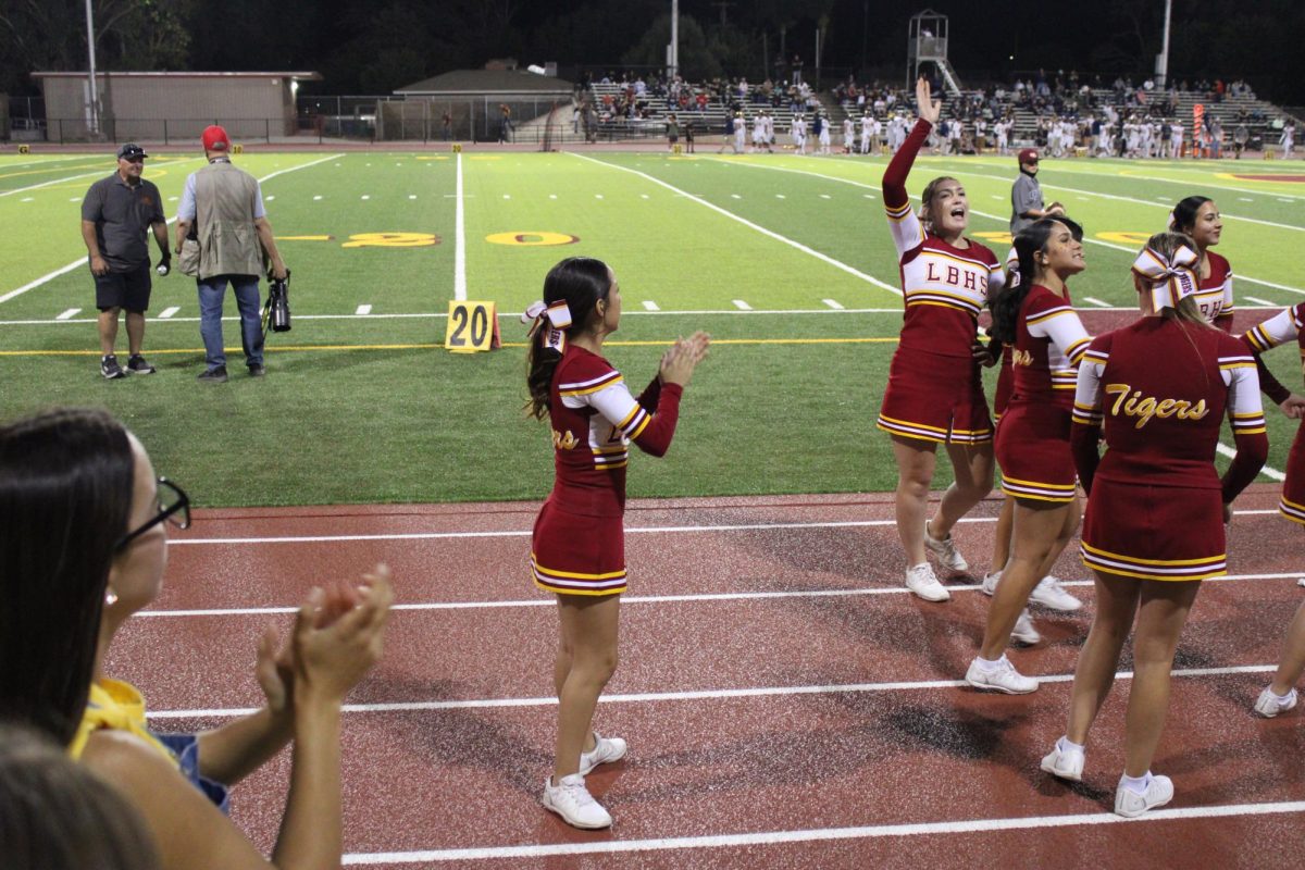 Samira Esparza cheers on the sidelines.