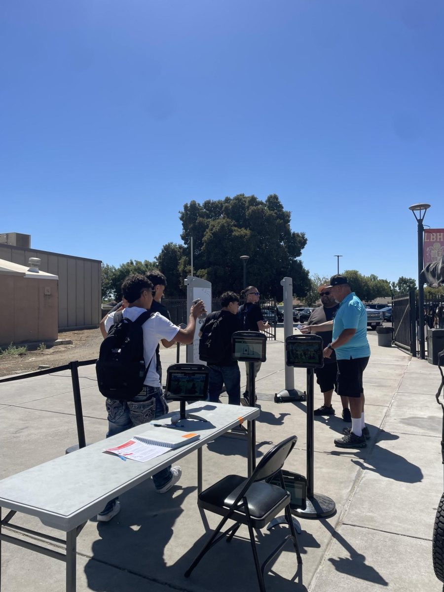 Students walk through metal detectors each time they leave campus.