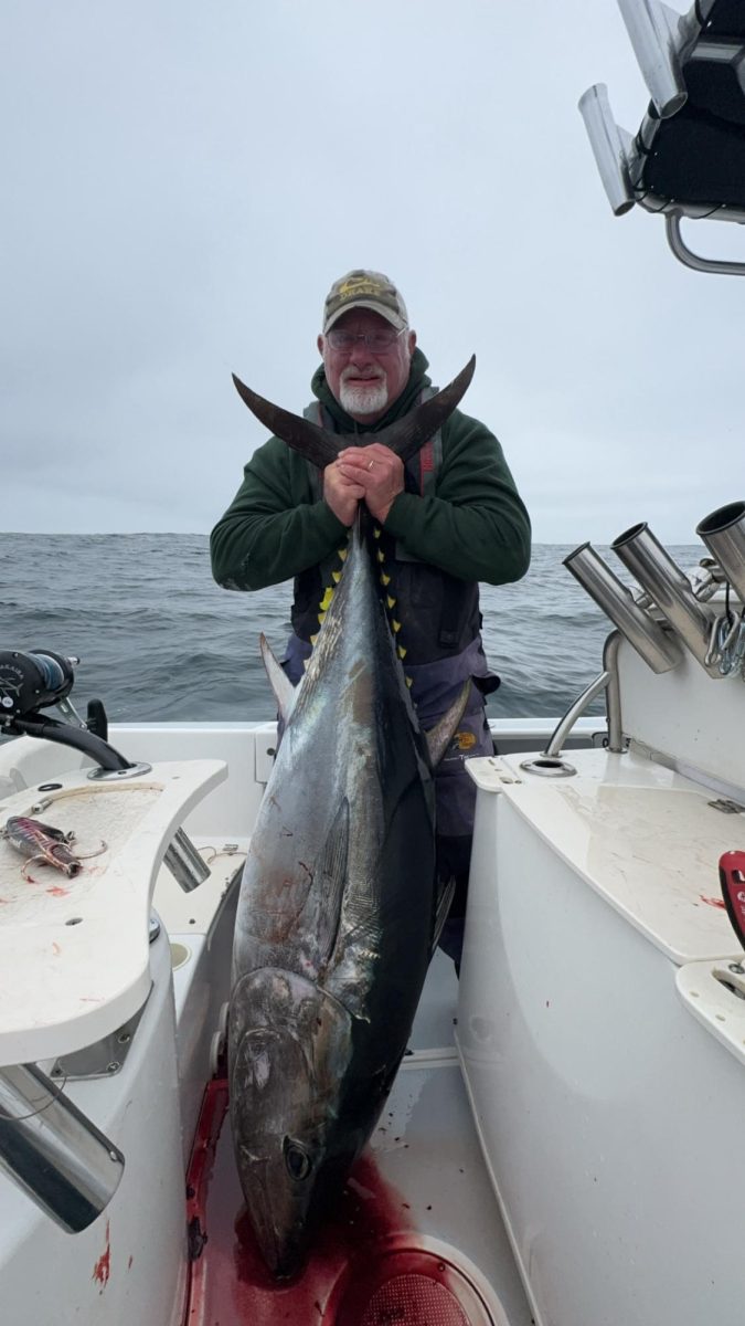 Mr. Stuart McCullough enjoys fishing of all kinds, especially when he lands a blue fin tuna this size.