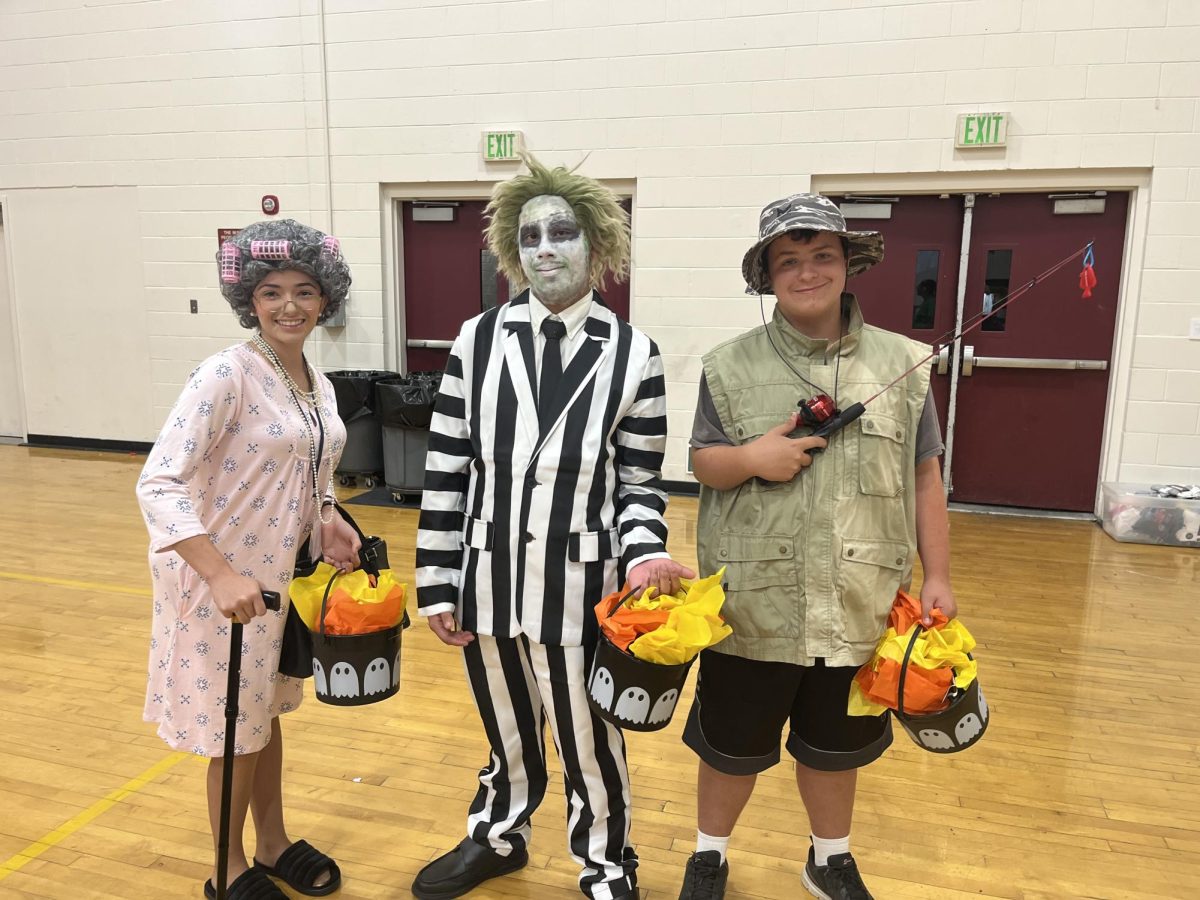 Gabriela Brazil (12), Anthony Orozco (11), and Shaun Allison (9) participate in the costume contest for FFA's October meeting.
