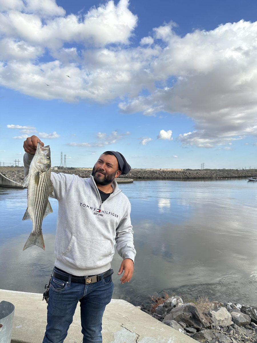 My father, Cain Macias when we went striper fishing.