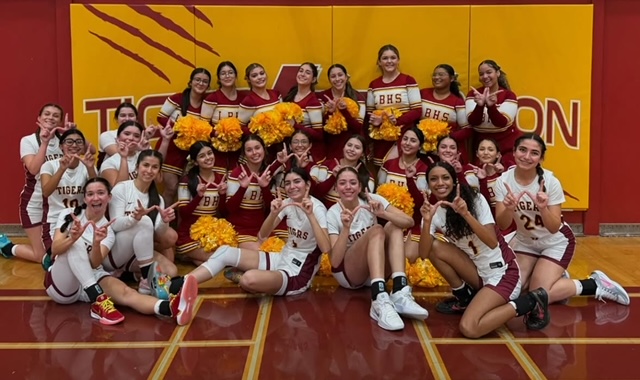 The Girls Varsity Basketball team takes a picture with the Los Banos Cheerleaders after their win. 