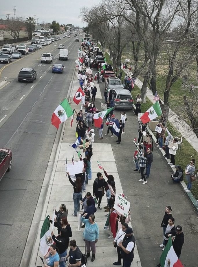 Picture taken by a student protester looking towards the united Hispanic/Latino community peacefully protesting. 