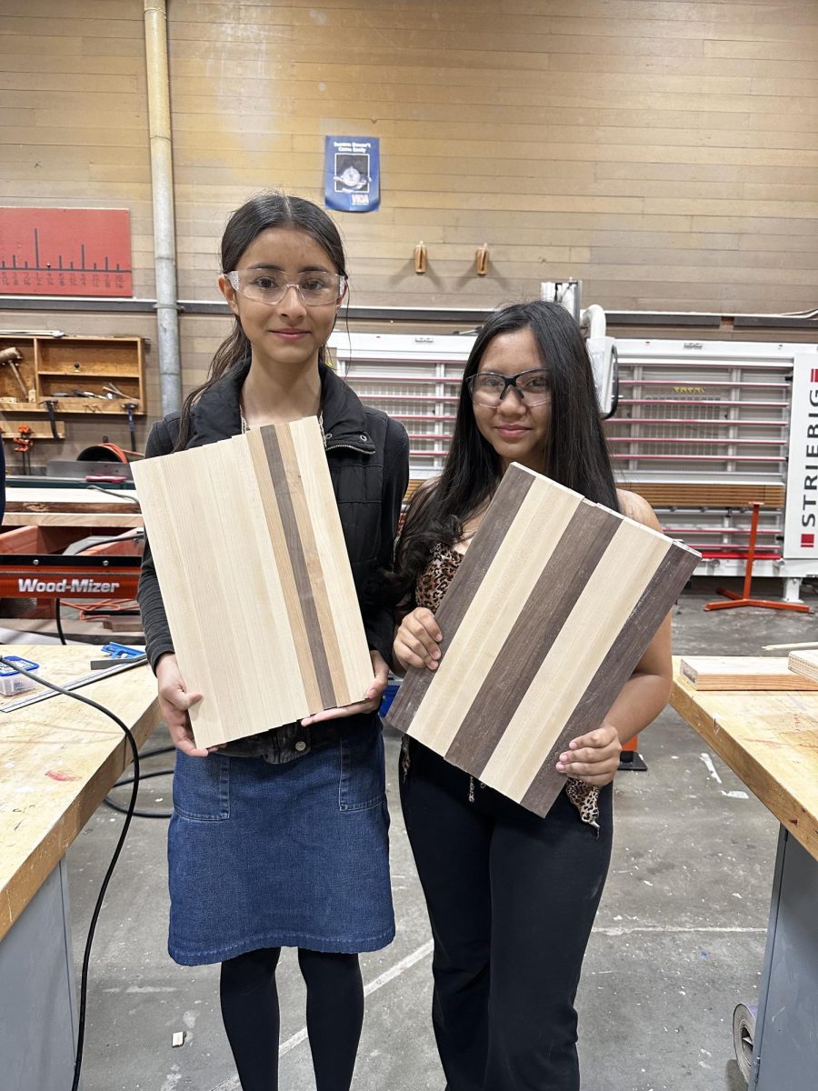 Ruth Ceballos (9) and Melisa Gamez (9) with their cutting boards.