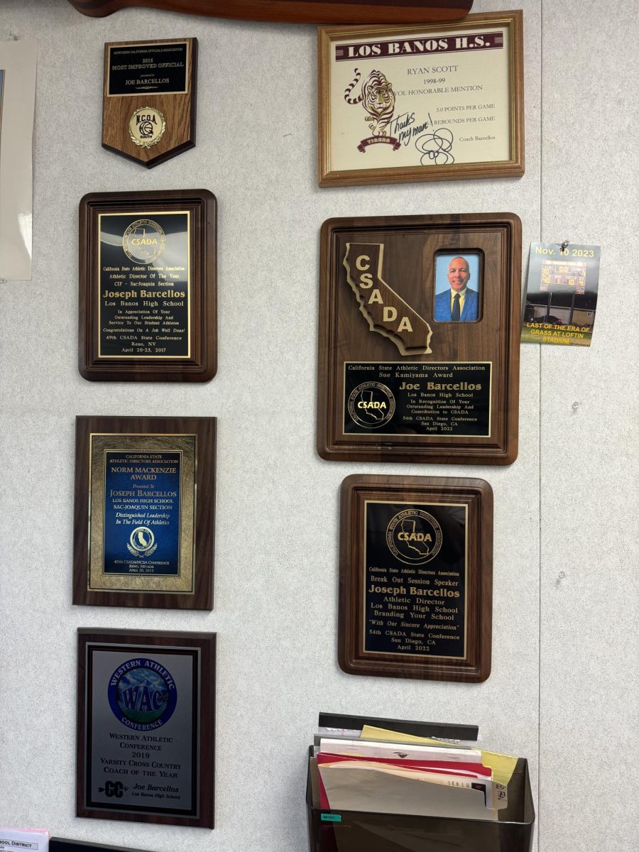 Mr. Joe Barcellos shows his awards from his years of service at LBHS.