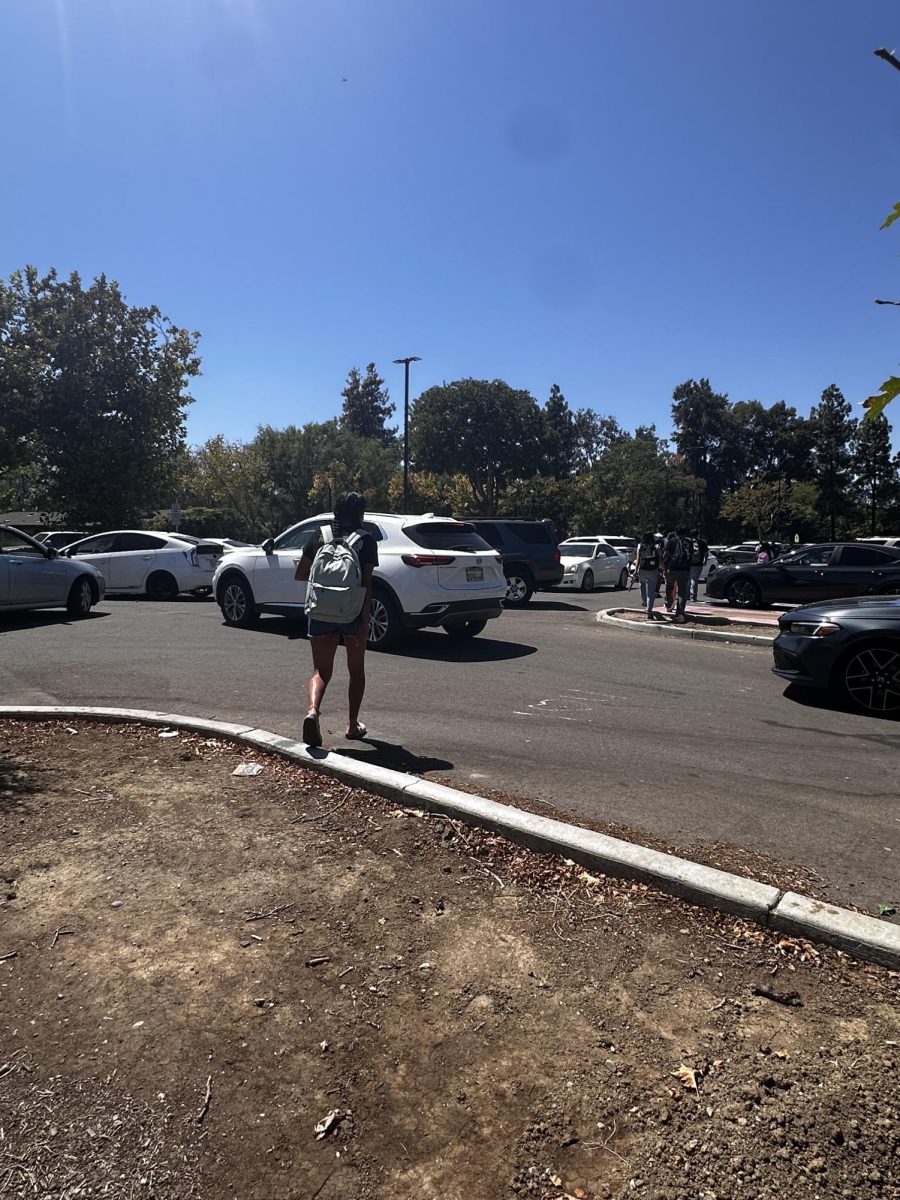 Students leave a crowded student parking lot during lunch. 