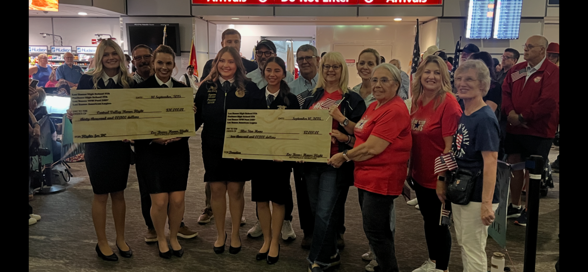 FFA members present checks from proceeds raised to help organizations.