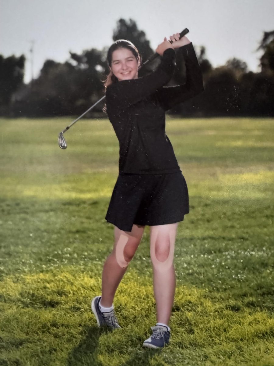 Brooke Barton practices her swing in hopes to play well this season.