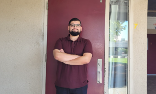Mr. Villeda stands in front of his classroom ready for the new school year.