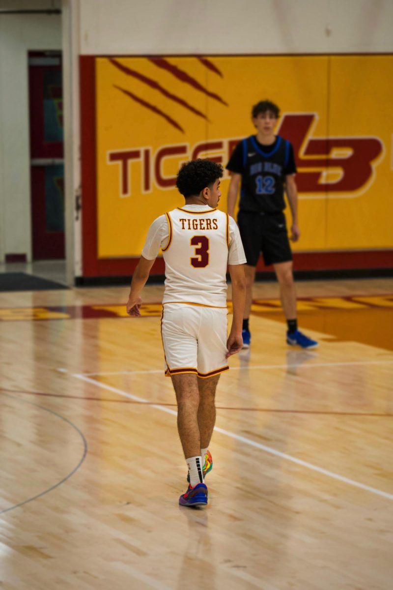 Varsity basketball plays against Merced.