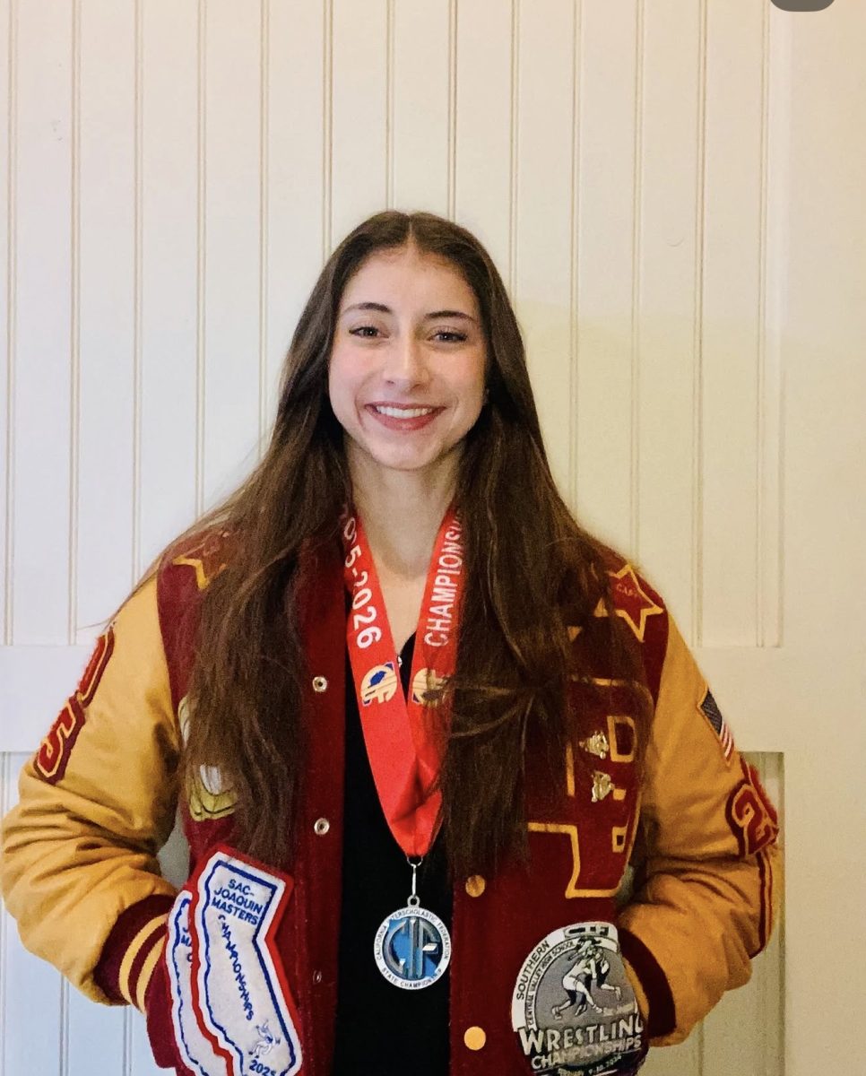 Angelina Borelli breaks a new school record of 2nd place in the nation for wrestling.