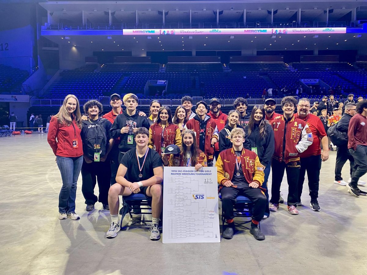 Wrestling team poses after wrestling at Masters and punching their tickets to state.